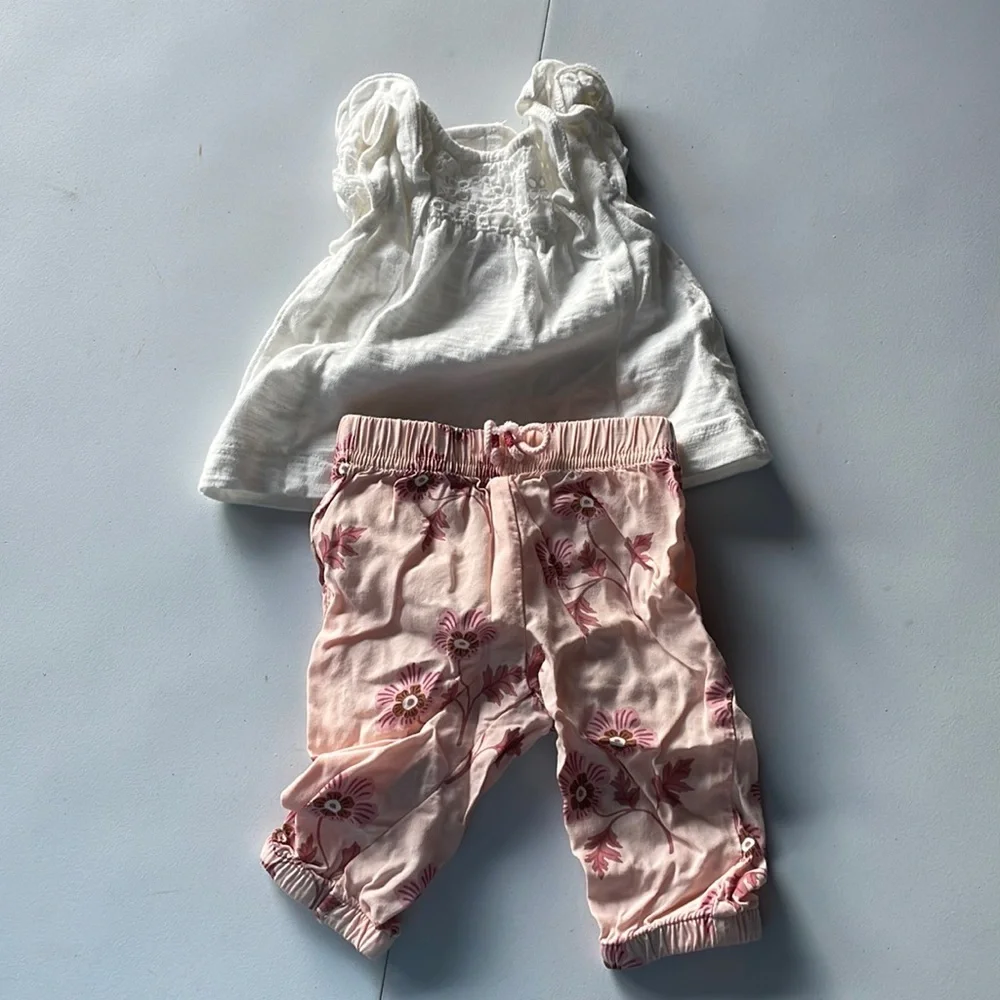 Carter’s newborn flowered pants with white eyelet shirt